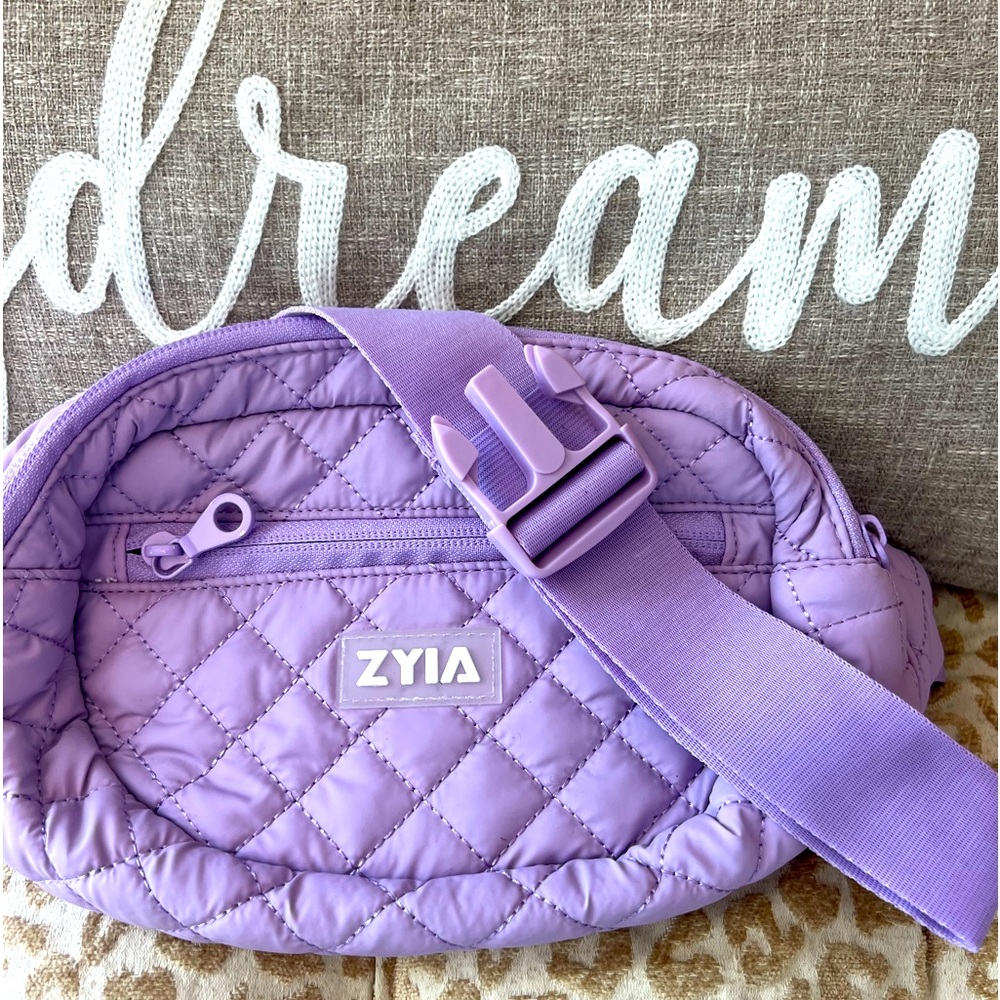 ZYIA LAVENDAR FANNIE PACK.Many compartments and zippered pouches. NEVER USED